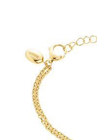 Bracelet en acier doré avec des chaînes reliées et un fermoir en pince de homard. Présente une étiquette ovale de marque avec "B R E I L L" gravé dessus.