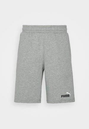 Jasnoszare spodenki Puma z elastycznym pasem i bocznymi kieszeniami, z logo Puma w czerni i bieli na dolnej lewej nodze.