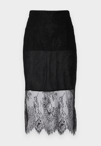 Black pencil skirt with a sheer lace bottom, featuring floral patterns. The material is a mix of solid and lace textures. Edges are scalloped.
