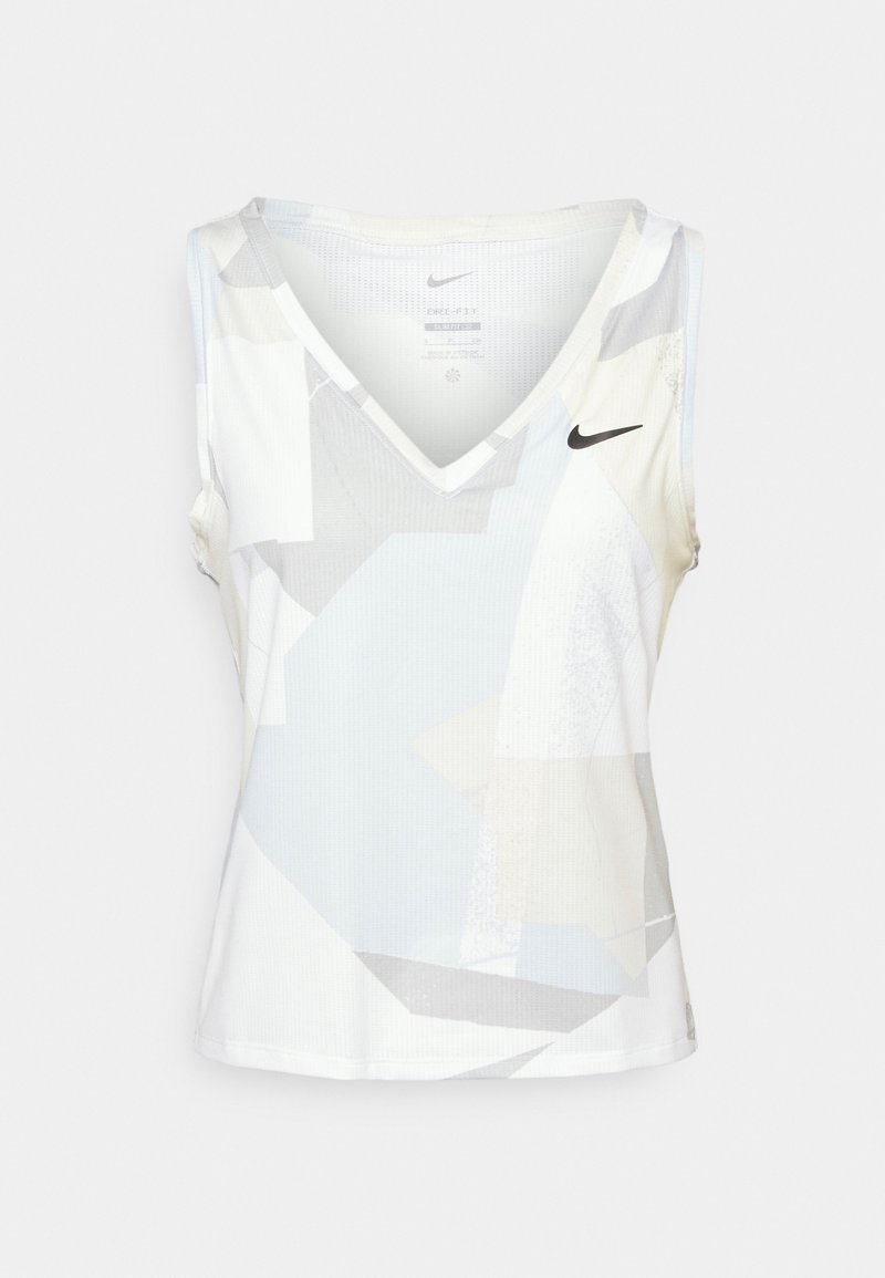 Haut de sport sans manches blanc avec motifs géométriques gris clair et logo Nike swoosh noir sur la poitrine supérieure.