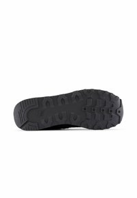 Black running shoe sole with deep tread pattern, featuring textured rubber for grip and durability. Reinforced toe cap and arch support.