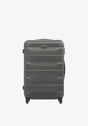 Twarda walizka w kolorze ciemnoszarym z czterema obracanymi kółkami i bocznym uchwytem, oznaczona marką "Ochnik".