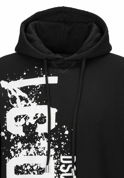 Hoodie en coton noir avec un grand design graphique blanc aux effets de éclaboussures, cordons de serrage réglables et intérieur en tissu doux et texturé.
