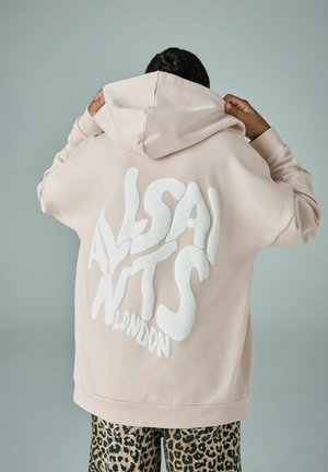 Helle rosa, oversized Kapuzenpullover mit großem weißen "ALLSAINTS"-Logo auf der Rückseite. Weicher Stoff mit einer Front-Kängurutasche und verstellbarem Kapuzenbereich.