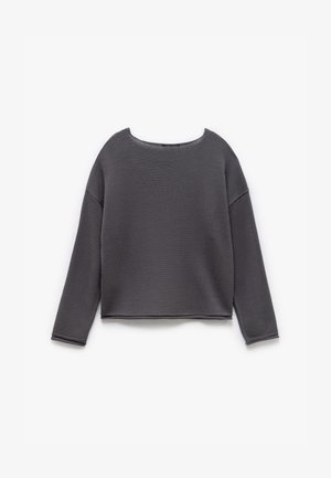 Gray knit sweater with a wide, rounded neckline, long sleeves, and a cropped design. Features a textured fabric and visible stitching details.