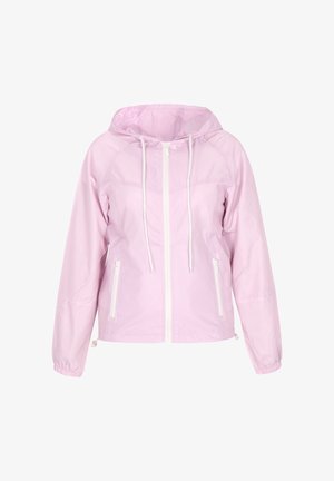 Világos rózsaszín kapucnis dzseki, cipzárral elöl, fehér zsinórokkal, két oldalzsebbel és elasztikus mandzsettával. Simább, könnyű anyagból készült.