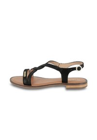 Sandalias negras con correas texturizadas, diseño de punta abierta, suela plana y un acento redondo en el tobillo. Plantilla beige con un logo sutil.
