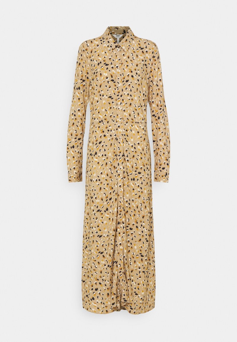 Robe chemise à manches longues en tissu jaune clair avec des motifs abstraits noirs et marron, présentant une coupe droite et une longueur mi-mollet.