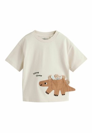 Cream-colored short-sleeve toddler shirt with a brown dinosaur applique holding a baby dinosaur, and "stomp stomp" text on front.
