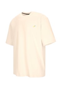 Crème-kleurige oversized T-shirt gemaakt van katoen, met een kleine gele en blauwe grafische print op de linkerkant van de borst en een ronde hals.
