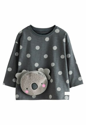 Graues Langarmshirt mit großen, hellgrauen Punkten und einer plüschigen Koala-Tasche auf der Vorderseite, die Ohren und ein Reißverschlussfach hat.