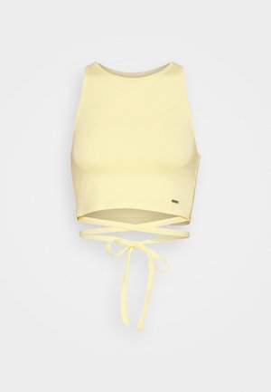 Gul cropped tank top med høj hals, der har en snøring i taljen og en glat, strækbar stof. Minimalistisk design.