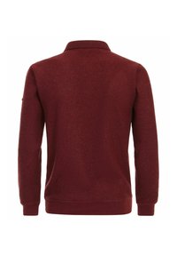 Burgundowa koszulka polo z długim rękawem, o teksturowanej tkaninie, z prążkowanym kołnierzykiem i mankietami. Posiada prosty dół i detal na plecach.