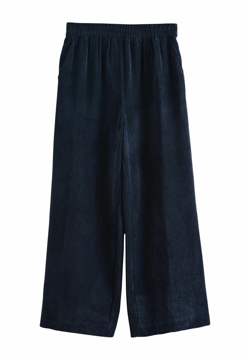 Dark blue wide-leg pants made from soft, ribbed fabric. Features an elastic waistband and side pockets for functionality.