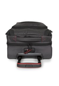 Black and gray wheeled luggage with a textured surface, multiple zippered compartments, and a retractable handle featuring red accents.