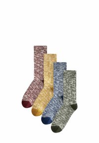 Vier Paar Socken in kastanienbraun, senfgelb, blau und grün, mit einem strukturierten Strickmuster und kontrastierenden Farben der Zehen.