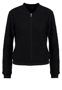 Giacca bomber nera con un intricato motivo in pizzo, polsini e orlo a coste, chiusura con zip e scollo rotondo. Tessuto leggero e testurizzato.