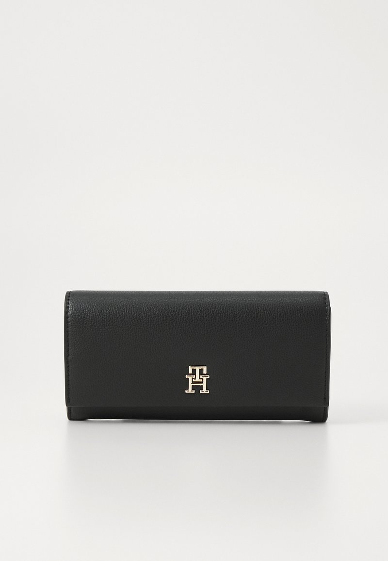 Black leather wallet with a textured finish, featuring a gold logo accent on the front and a folding design for compact storage.