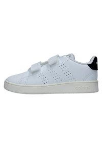 White athletic shoes with velcro straps, perforated upper for breathability, black accent at heel, and textured rubber sole.