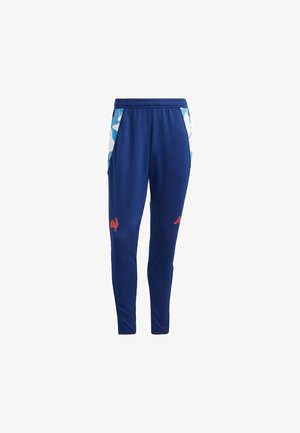 Blå polyester joggers med en tætsiddende pasform, med hvide sidelæder og røde logoer på fronten. Elastisk taljebånd for en sikker pasform.
