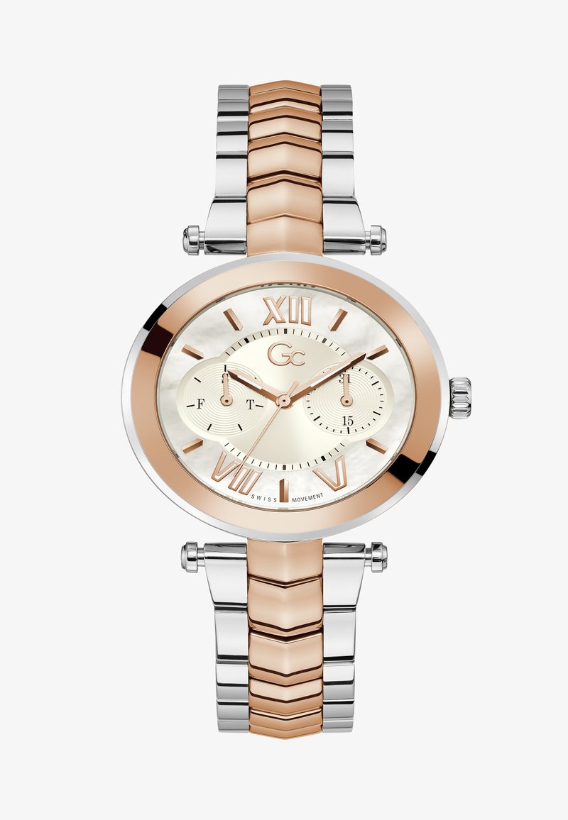 Apaļš sudraba un rozā zelta pulkstenis ar māte-pērļu ciferi, romiešu cipariem un divkrāsu saistīto aproci. Iekļauj apakšciferus laikam.