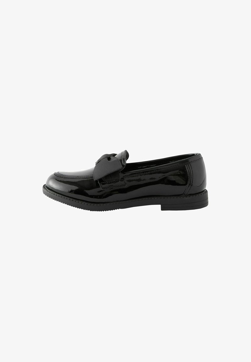 Black patent leather loafer with a rounded toe and a decorative bow on the front. Low black rubber sole and smooth glossy finish.