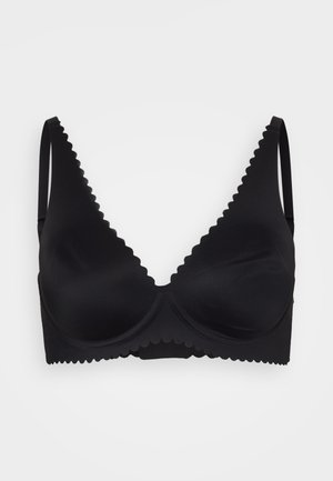 Black bra with scalloped edges, molded cups, adjustable straps, and a smooth, textured finish. No underwire visible.