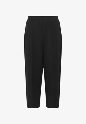 Pantalon noir sur mesure, longueur cheville, avec une taille haute et des plis marqués à l'avant, conçu pour une coupe slim et élégante.