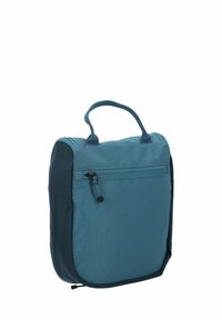 Bolsa compacta de tela azul con una superficie texturizada, asa en la parte superior y un bolsillo frontal con cremallera. Esquinas redondeadas y paneles laterales oscuros en contraste.