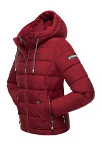 Red padded jacket with a hood, zippered front, elastic cuffs, and branded sleeve accent. Features multiple zippered pockets and textured fabric.