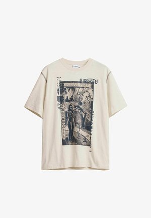 Beige short-sleeve T-shirt with black graphic depicting a person, plants, and abstract shapes in a rectangular frame on front.