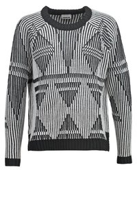 Svart och vit stickad tröja med ett geometriskt mönster, med en ribbad rund halsringning och muddar, tillverkad av ett mjukt material.