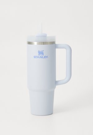 Large light blue insulated mug with a stainless steel band, clear lid, straw, and side handle; features the "STANLEY" logo.