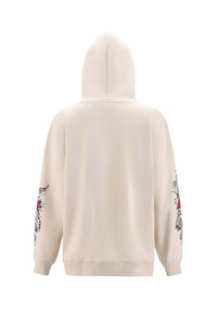 Béžová mikina s kapucí a dlouhými rukávy. Obsahuje černé a červené květinové motivy na obou rukávech. Měkká textura, volný střih a žebrované manžety.
