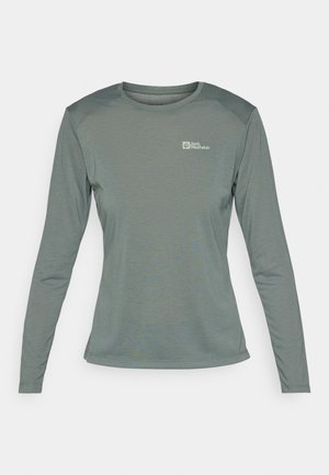 Long-sleeve t-shirt in muted green, made of lightweight, textured fabric. Features rounded neckline and small logo on left chest.