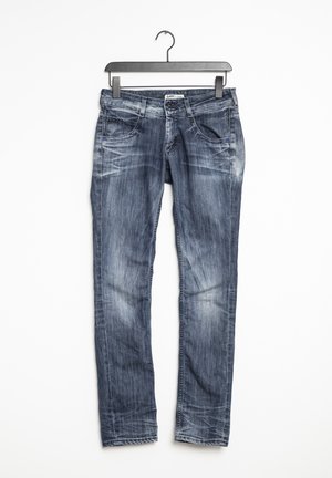 Jeans de mezclilla en azul oscuro con desgaste ligero, diseño de cinco bolsillos, presillas para cinturón y corte recto. La tela es suave con una ligera textura.