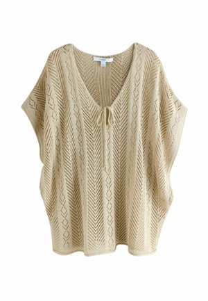 Beige strikket ærmeløs top med diamant- og chevronmønstre, V-hals og bindelukning foran.