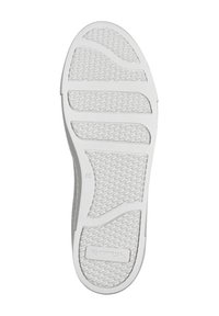 Suola di scarpa in gomma bianca con una superficie texture, a motivo e scanalature orizzontali per la trazione; presenta il marchio "Toms" sulla parte centrale della suola.