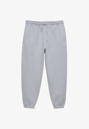 Pantalon de survêtement gris clair avec taille élastique et cordon, jambes fuselées avec poignets élastiques, et petit logo blanc sur la hanche droite.