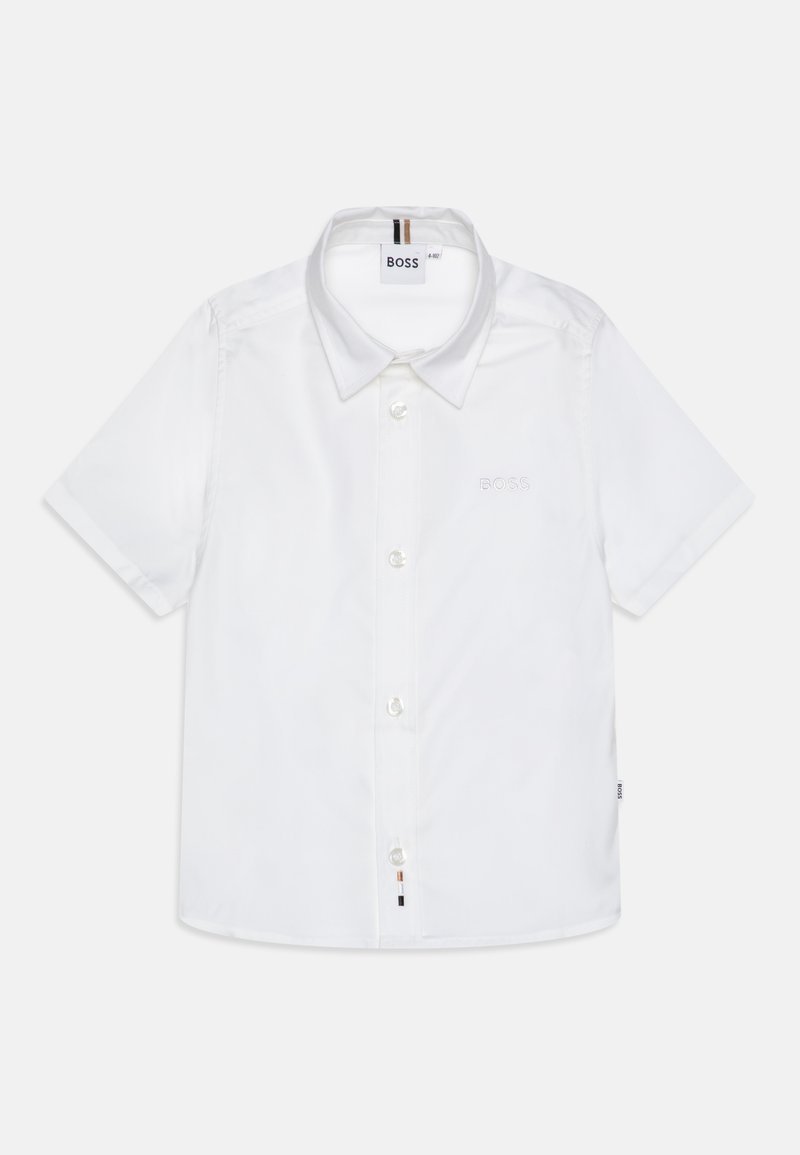 Balta trumpa rankovėmis marškiniai, pagaminti iš lygios medžiagos. Dėvima klasikinė apykaklė, mygtukų uždarymas ir subtili siuvinėta aptarnavimo logotipas ant krūtinės.