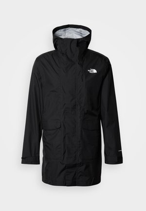 Fekete vízálló dzseki kapucnival, elülső cipzárral és két nagy zsebbel. Bal mellrészen logóval és állítható mandzsettákkal. Könnyű anyagból készült.