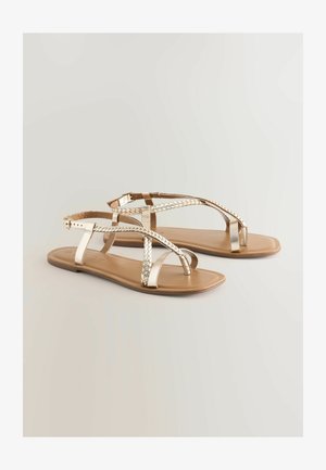 Sandale plate metalice aurii cu întrețesute și o talpă interioară netedă de culoare bej. Prezintă o închidere cu cataramă și un design cu vârf deschis pentru respirabilitate.