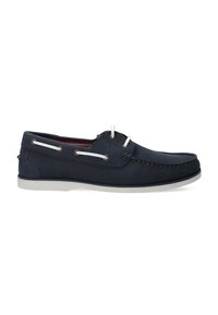 Marineblaue Lederbootsschuhe mit weißen Schnürsenkeln, kontrastierender weißer Sohle, Nähdetails und einem runden Zehenbereich.