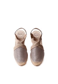 Brown woven espadrille shoes with cross straps, jute soles, and a rounded toe. Fabric texture appears breathable and lightweight.