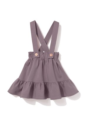 Fioletowa spódniczka dla malucha z marszczonym dołem i regulowanymi, skrzyżowanymi ramiączkami zapinanymi na drewniane guziki.