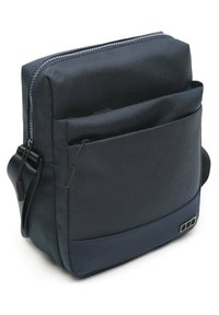 Borsa a tracolla blu navy realizzata in tessuto testurizzato, con scomparto principale con zip, tasca frontale e tracolla regolabile.