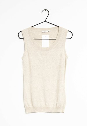 Top beige senza maniche su una gruccia nera, con una scollatura ampia e orlo a coste. Tessuto morbido e leggero con una superficie liscia.