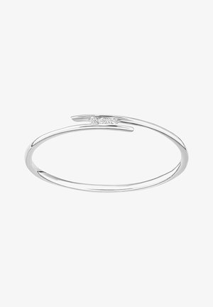 Bracelet jonc en argent au design élancé, avec une texture lisse et un petit accent de diamant au centre.