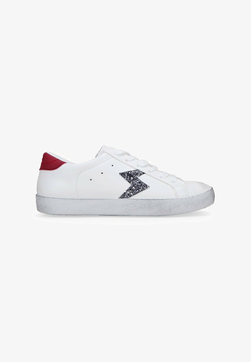 White sneakers with a textured silver sole, red heel accent, and a glittery silver lightning bolt design on the side.