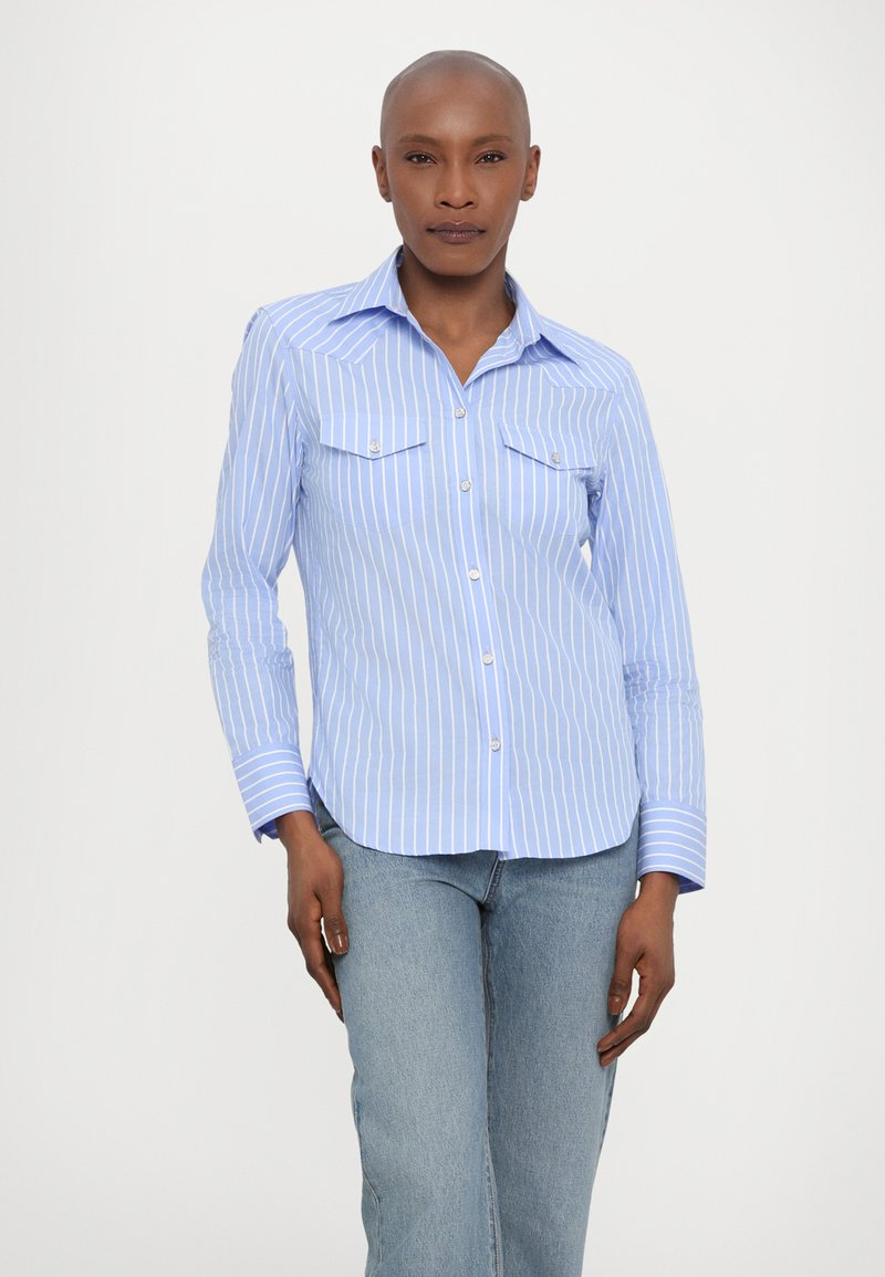 Blue and white striped button-up shirt with a collar, two chest pockets, and long sleeves. The fabric appears smooth and lightweight.